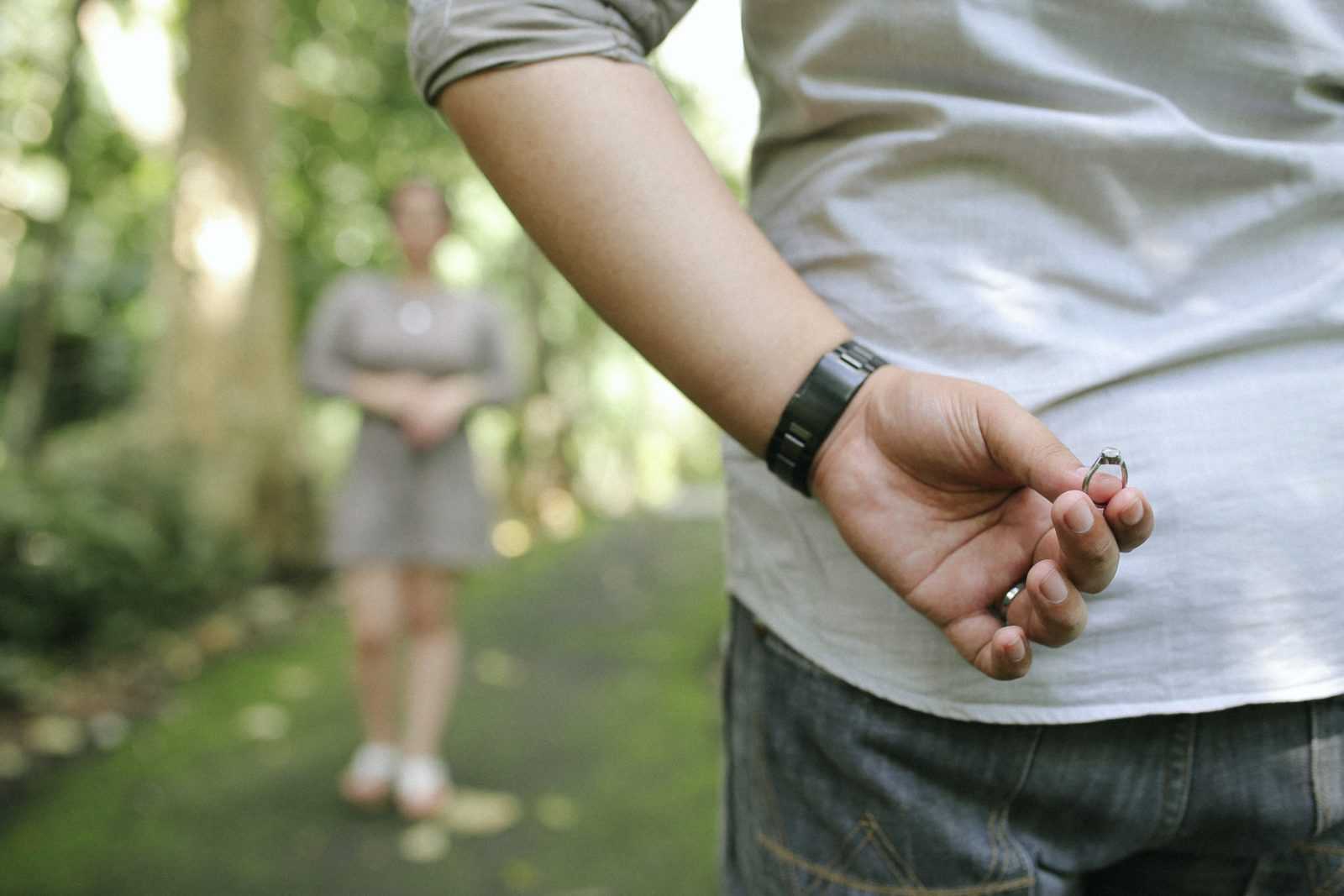 close up of person holding ring about to propose